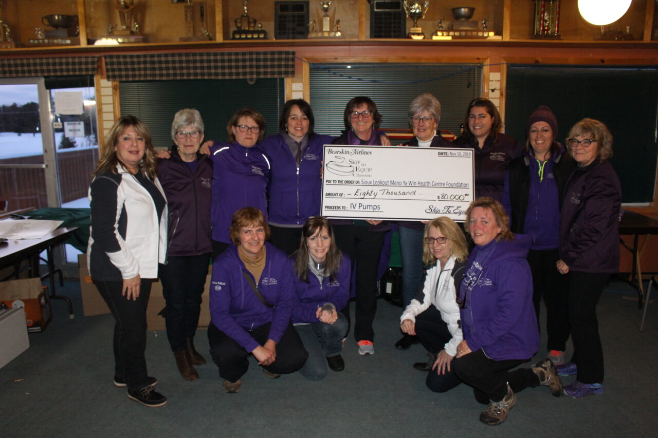 Group shot of the cheque donation during Bearskin Airlines Skip to Equip Classic.