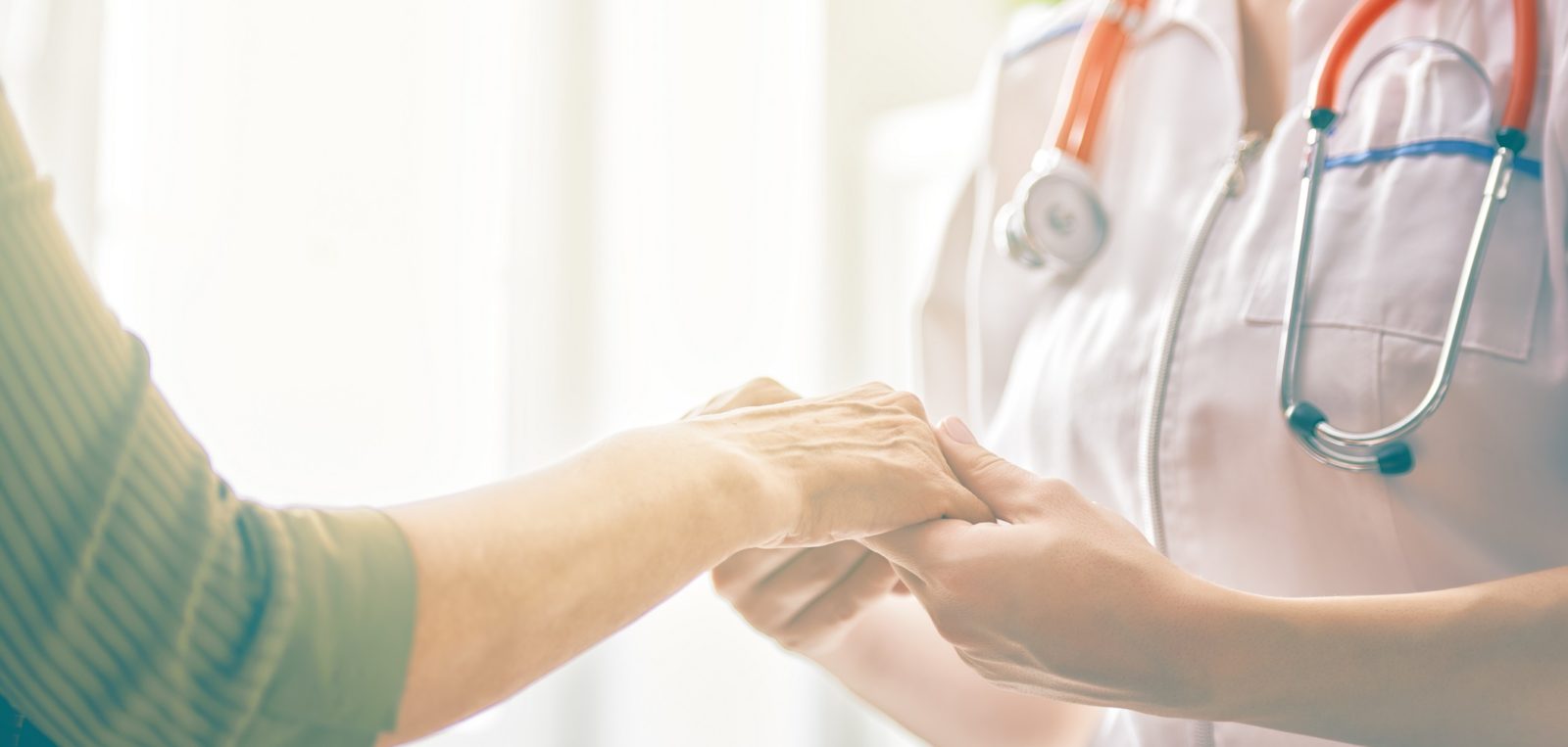 cancer care stock image hands patient and doctor